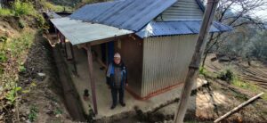 Tek outside the home he built