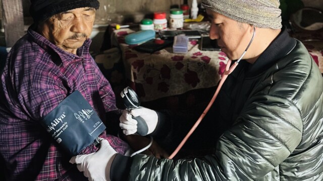 Tara Nath Bhandari has his vitals checked in his home